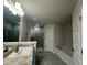 Well lit bathroom with modern finishes, a soaking tub, and a glass enclosed shower at 77 Olive Dr, Ocala, FL 34472