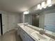 Modern bathroom with double vanity and walk-in shower at 77 Olive Dr, Ocala, FL 34472