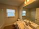 Clean bathroom with updated fixtures and a large mirror at 77 Olive Dr, Ocala, FL 34472