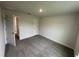 Carpeted bedroom with an open doorway and neutral walls at 77 Olive Dr, Ocala, FL 34472