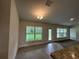 Inviting dining area with a backyard view, tile floors, and stylish chandelier at 77 Olive Dr, Ocala, FL 34472