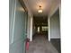 Inviting entryway with tile flooring and a view into the spacious, light-filled living area at 77 Olive Dr, Ocala, FL 34472