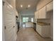 Well-lit kitchen with white cabinetry, stainless steel appliances, and granite countertops at 77 Olive Dr, Ocala, FL 34472