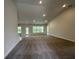 Open-concept living room with recessed lighting, neutral walls, and plush carpet flooring at 77 Olive Dr, Ocala, FL 34472