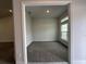 A versatile home office space bathed in natural light with neutral walls and carpet at 77 Olive Dr, Ocala, FL 34472