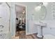 Bathroom with pedestal sink, tub, and home gym view at 7727 Sw 102Nd Loop, Ocala, FL 34476