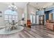 Bright dining room with chandelier and hardwood floors at 7727 Sw 102Nd Loop, Ocala, FL 34476