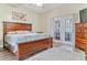 Large main bedroom with a king-size bed and direct access to the patio at 7727 Sw 102Nd Loop, Ocala, FL 34476