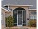 Enclosed porch with white framed screen door at 7727 Sw 102Nd Loop, Ocala, FL 34476