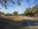 Quiet residential street lined with lush trees and homes at 7727 Sw 102Nd Loop, Ocala, FL 34476