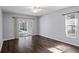 Bedroom with dark hardwood floors and pool access at 7795 Sw 181St Cir, Dunnellon, FL 34432