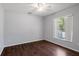 Bright bedroom with wood floors and a window at 7795 Sw 181St Cir, Dunnellon, FL 34432