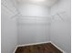 Empty closet with wire shelving and dark floors at 7795 Sw 181St Cir, Dunnellon, FL 34432