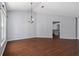 Bright dining room with hardwood floors and view into kitchen at 7795 Sw 181St Cir, Dunnellon, FL 34432