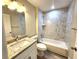 Bathroom featuring granite vanity top, shower and tub at 7799 Sw 132Nd Pl # 10, Ocala, FL 34473