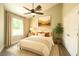 Cozy bedroom featuring an area rug, an earth tone color scheme and a ceiling fan at 7799 Sw 132Nd Pl # 10, Ocala, FL 34473
