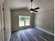 Bedroom featuring vaulted ceiling, ceiling fan, and large window at 7799 Sw 132Nd Pl # 10, Ocala, FL 34473