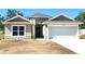 Charming single Gathering home featuring an attached two car garage and well maintained lawn at 7799 Sw 132Nd Pl # 10, Ocala, FL 34473