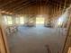 Large living room under construction with exposed framing and windows at 7799 Sw 132Nd Pl # 10, Ocala, FL 34473