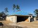 New construction home with block exterior and blue roofing underlayment at 8797 Se 161St Pl, Summerfield, FL 34491