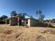 New construction home with block exterior and blue roofing underlayment at 8797 Se 161St Pl, Summerfield, FL 34491