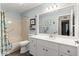 Bathroom features a shower/tub combo and white vanity at 9176 Sw 93Rd Cir, Ocala, FL 34481