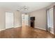 Bedroom with double doors and wood-look flooring at 9176 Sw 93Rd Cir, Ocala, FL 34481