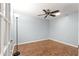 Bright bedroom with ceiling fan and wood-look floors at 9176 Sw 93Rd Cir, Ocala, FL 34481