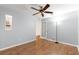 Spacious bedroom featuring wood-look floors and built-in shelving at 9176 Sw 93Rd Cir, Ocala, FL 34481