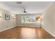 Bright living room featuring hardwood floors and a large window at 9176 Sw 93Rd Cir, Ocala, FL 34481