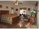 Spacious bedroom with wood flooring and a large bed at 9221 Sw 193Rd Cir, Dunnellon, FL 34432