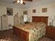 Bright bedroom featuring a floral bedspread and ample storage at 9221 Sw 193Rd Cir, Dunnellon, FL 34432