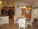 Bright dining area with a glass-top table and wicker chairs at 9221 Sw 193Rd Cir, Dunnellon, FL 34432