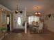 Formal dining room with a chandelier and seating for six at 9221 Sw 193Rd Cir, Dunnellon, FL 34432