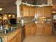 Modern kitchen with granite countertops and wood cabinets at 9221 Sw 193Rd Cir, Dunnellon, FL 34432