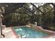 Inviting screened pool area with fountain and ample deck space at 9221 Sw 193Rd Cir, Dunnellon, FL 34432