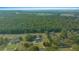 Overhead view of the property, highlighting the home's placement in the expansive landscape at 9748 Sw 74Th Ave, Ocala, FL 34476