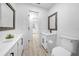 Bathroom featuring a sink, toilet, and vinyl floors at 9748 Sw 74Th Ave, Ocala, FL 34476