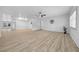 Bright living room featuring light wood floors, a modern ceiling fan, neutral paint and ample natural light at 9748 Sw 74Th Ave, Ocala, FL 34476