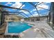 Enjoy this backyard pool with diving board, spa and large screened in enclosure at 9748 Sw 74Th Ave, Ocala, FL 34476