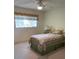 Cozy bedroom with a twin bed and carpeted floor at 9827 Sw 96Th St, Ocala, FL 34481