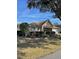 Single-story house with a brown roof and landscaping at 9827 Sw 96Th St, Ocala, FL 34481