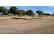 View of a golf course with trees and green fairways at 9827 Sw 96Th St, Ocala, FL 34481