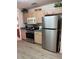 Kitchen with stainless steel appliances and light wood cabinets at 9827 Sw 96Th St, Ocala, FL 34481