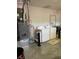 Laundry room with washer, dryer, and water heater at 9827 Sw 96Th St, Ocala, FL 34481