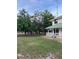 Home's fenced backyard offers privacy and views of the surrounding trees at 10245 Sw 105Th St, Ocala, FL 34481
