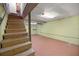Basement with stairs and painted concrete floors and walls at 10245 Sw 105Th St, Ocala, FL 34481