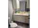Classic bathroom with a spacious vanity, a three-faucet sink, and tile countertops at 10245 Sw 105Th St, Ocala, FL 34481
