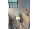 Simple bathroom with a standard toilet and a combination tub and shower with tile surround at 10245 Sw 105Th St, Ocala, FL 34481