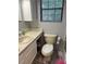 Bathroom featuring a sink and toilet at 10245 Sw 105Th St, Ocala, FL 34481